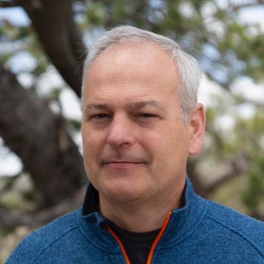 A head shot of Matthew C. Beard in an outdoors setting